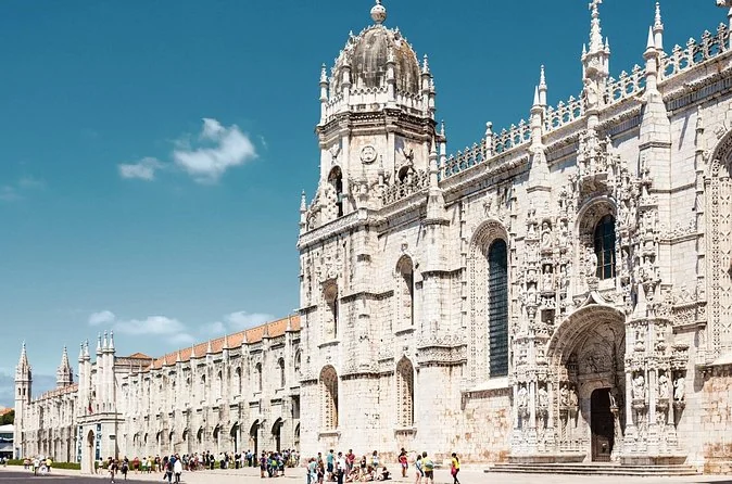 The long carved limestone facade of the Jerónimos Monastery